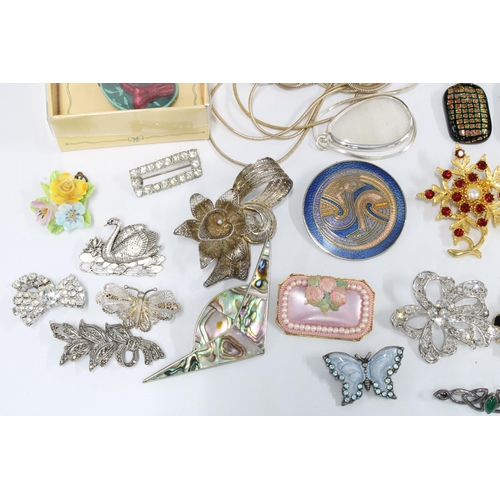 35 - Silver brooches, two  silver bangles, gold plated nephrite jade brooch and a collection of costume j... 