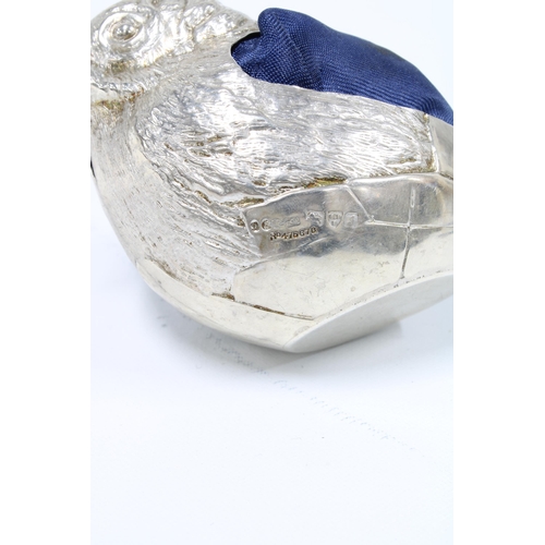 52 - Edwardian silver pin cushion in the form of a bird emerging from an egg, by Sampson Mordan & Co, Che... 