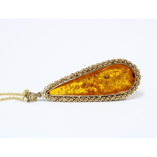 6 - 9ct gold chain with an amber pear shaped pendant, chain stamped 375