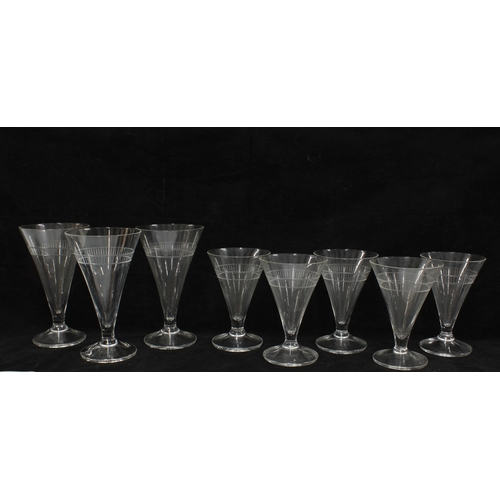 109 - Set of eight drinking glasses, conical bowls with engraved border pattern and a  teardrop bubble  in... 