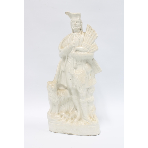 111 - 19th century Staffordshire white glazed figure of a piper, 37cm.