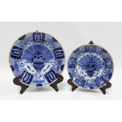 116 - Two 18th century Delft blue and white peacock tail pattern plates, each with a yellow rim, (2)  (a/f... 