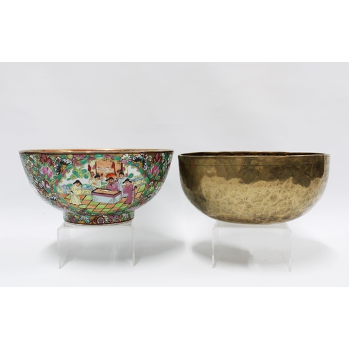 118 - Famille rose punch bowl and a hand beaten brass bowl, (2) 25.5cm.