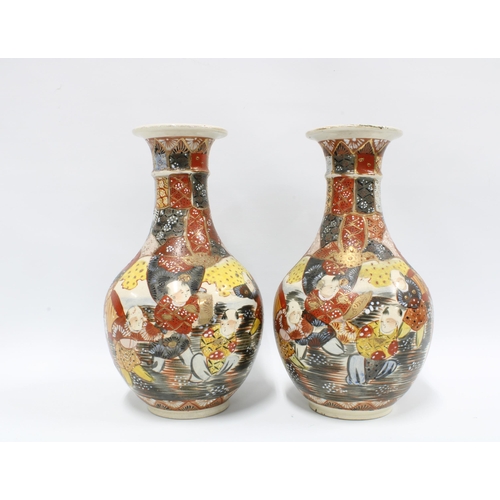 119 - A pair of Japanese earthenware vases, typically decorated with figures and stylised motifs (2) 30.5c... 