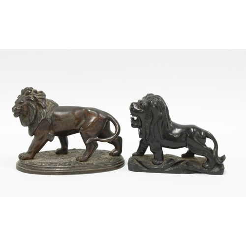 120 - Bronze figure of a lion and another in obsidian (2) 14cm.