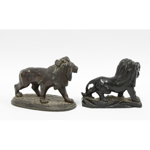 120 - Bronze figure of a lion and another in obsidian (2) 14cm.