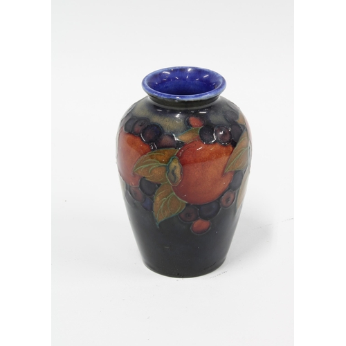 123 - Moorcroft Pomegranate vase, blue ground and impressed marks, 9.5cm.