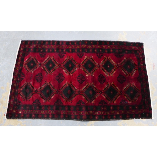 217 - Afghan rug, red field with two rows of six guls,  165 x 100