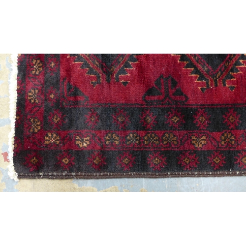 217 - Afghan rug, red field with two rows of six guls,  165 x 100