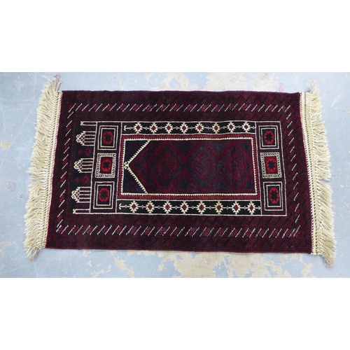 218 - Afghan prayer rug, red field with ivory mihrab, fringed ends, 138 x 85cm