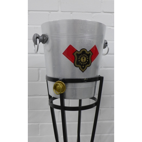 225 - Pair of Bollinger Extra champagne buckets in black metal stands (2)