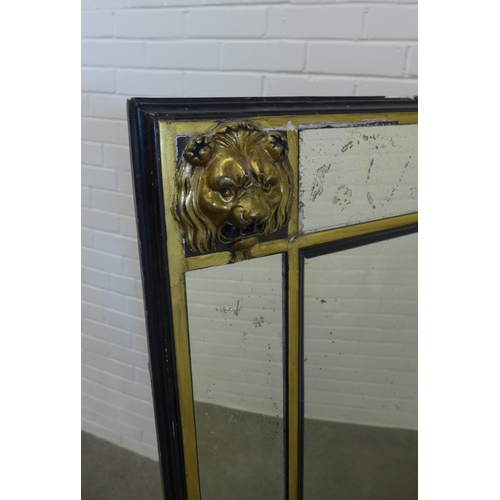 234 - Large wall mirror, the rectangular plate within an ebonised and parcel gilt frame with lion mask cor... 