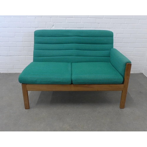 236 - Mid century two seater settee, upholstered in green wool mix fabric with a single end arm and teak f... 