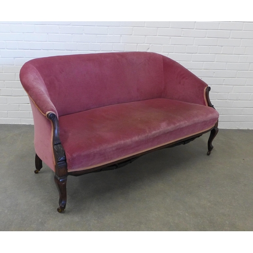 237 - Late 19th century mahogany framed two seater settee, with scroll arms and leaf carved legs, pale red... 