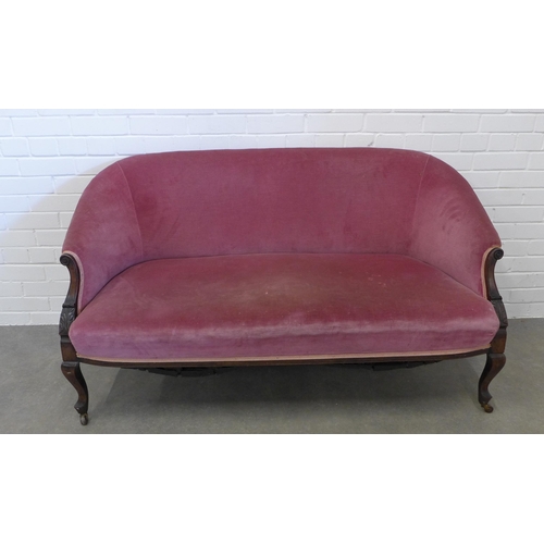 237 - Late 19th century mahogany framed two seater settee, with scroll arms and leaf carved legs, pale red... 