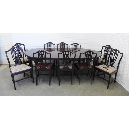 239 - Mahogany extending dining table with a set of 10 chairs including two carver chairs. 75 x 241 x 122c... 