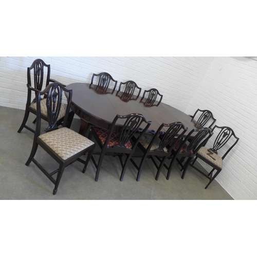 239 - Mahogany extending dining table with a set of 10 chairs including two carver chairs. 75 x 241 x 122c... 