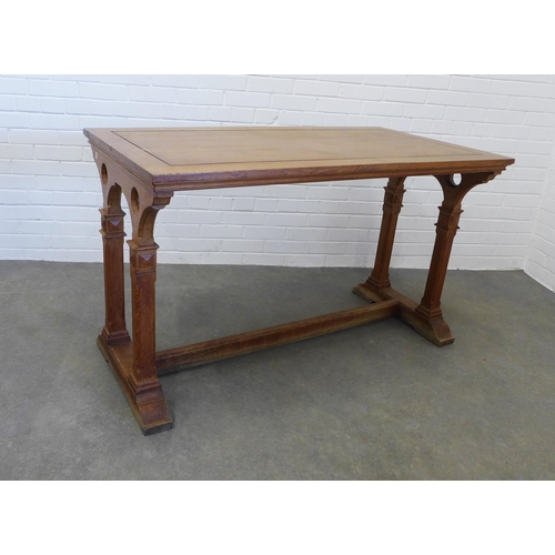 245 - Gothic Revival light oak table by Morison & Co Edinburgh, rectangular top on trestle end supports, u... 