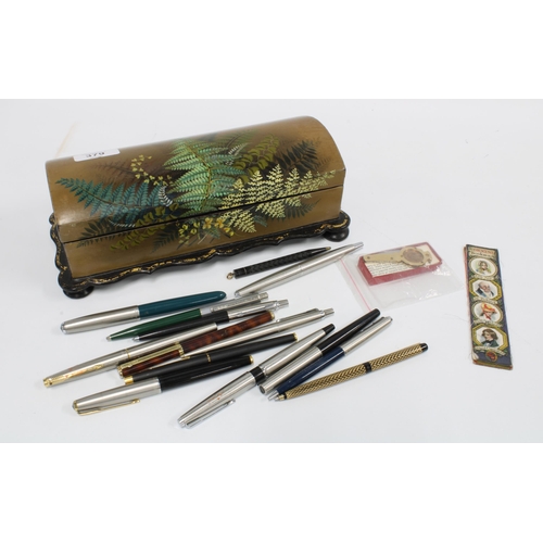 379 - Victorian lacquered glove box containing a collection of vintage ballpoint pens and a Dickens bookma... 