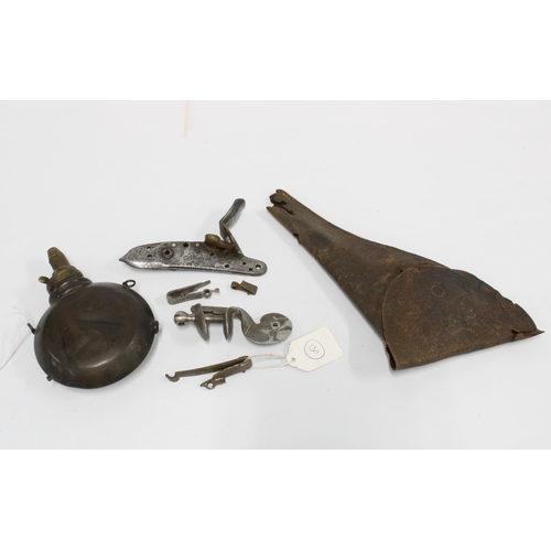 391 - A group of antique firearm parts and accessories to include flintlock action parts, a leather holste... 