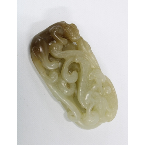 397 - Carved jade plaque with a panther and scrolling foliage, 6 x 3cm