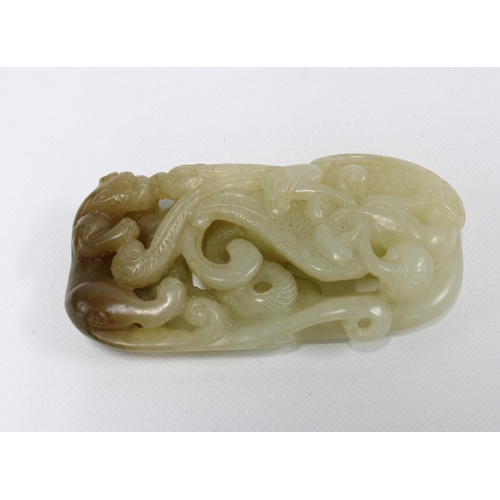 397 - Carved jade plaque with a panther and scrolling foliage, 6 x 3cm