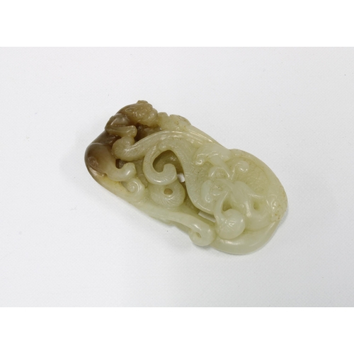 397 - Carved jade plaque with a panther and scrolling foliage, 6 x 3cm