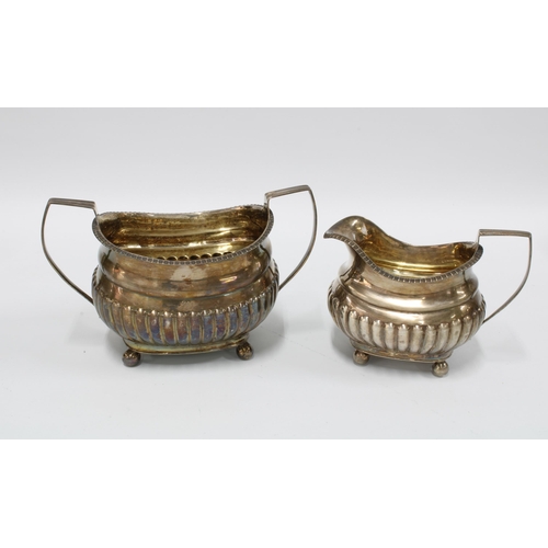 48 - Georgian silver cream jug and sugar bowl, half fluted with monogram, London 1812 (2)