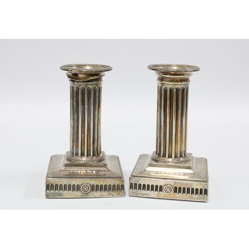 49 - Pair of Victorian silver dwarf candlesticks, Hawksworth, Eyre & Co, Sheffield 1885, with fluted colu... 