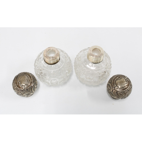 54 - A pair of silver top glass scent bottles, London 1915, 7cm high (2)
