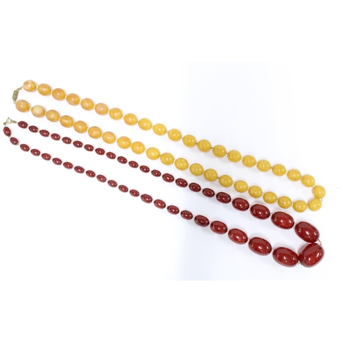 71 - Strand of faux cherry amber beads and a strand of butterscotch faux amber beads (2)