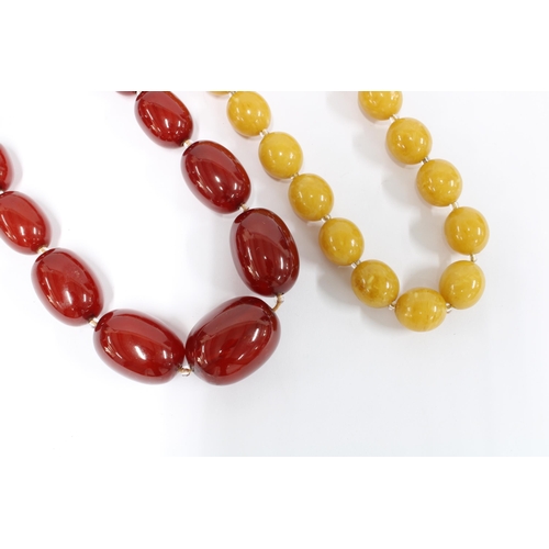 71 - Strand of faux cherry amber beads and a strand of butterscotch faux amber beads (2)