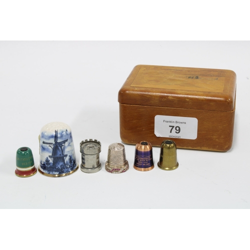 79 - A silver paste set thimble, Birmingham 1992, three Stanhope type thimbles, another castellated thimb... 