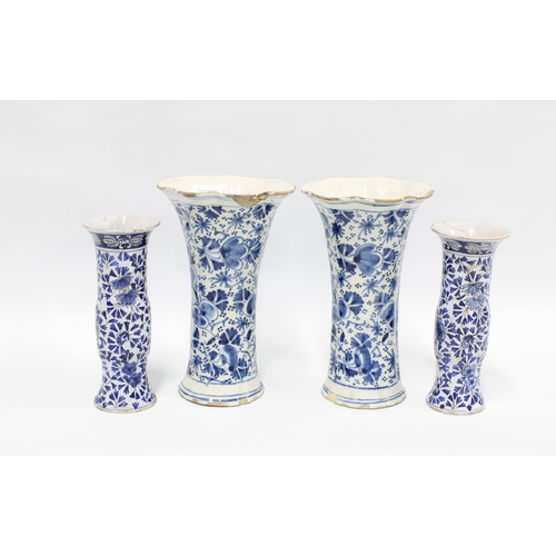 83 - A pair of delft blue and white vases with frilled rims and floral pattern together with a pair of sm... 