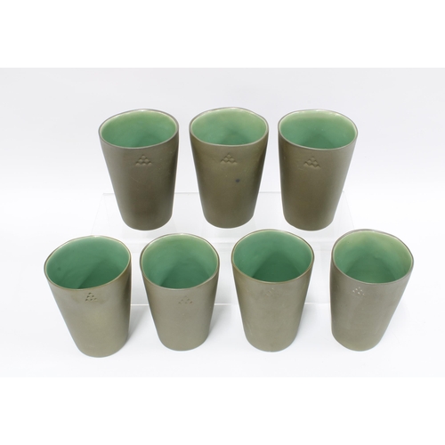 92 - Set of seven studio pottery beskers, sage matt glaze exterior with gloss interiors, (7) 12cm.