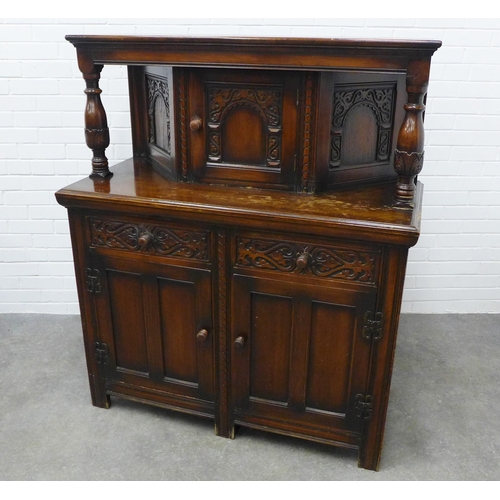 417 - Reproduction court cupboard of typical design with carved and panelled doors and drawers. 140 x 120 ... 