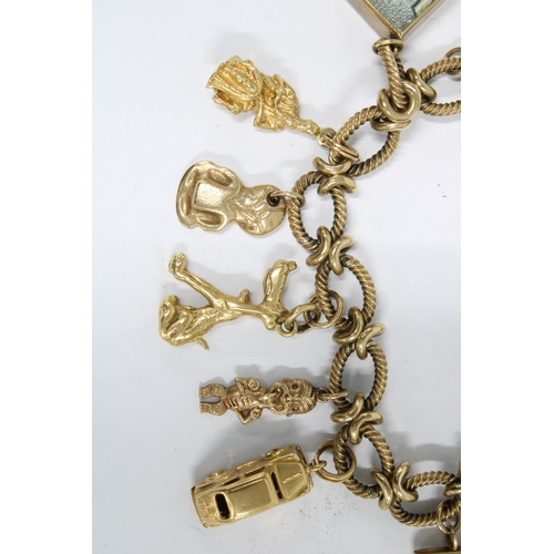 13 - 9ct gold charm bracelet with  thirteen yellow metal charms, six of which are stamped as 9ct gold