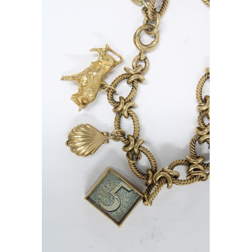 13 - 9ct gold charm bracelet with  thirteen yellow metal charms, six of which are stamped as 9ct gold