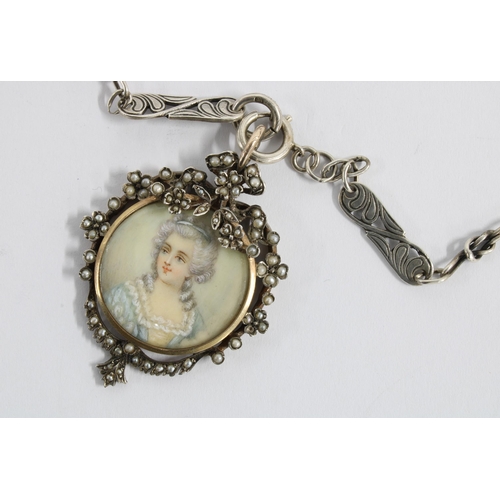 22 - Portrait miniature pendant in a circular yellow metal mount, within a white metal frame with seed pe... 