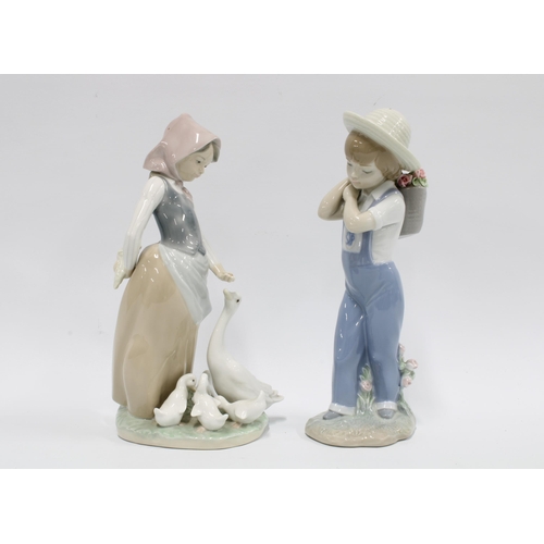 100 - Two Lladro figures, Flowers on the Back 1286 and 
a girl with geese,  taller 24cm (2)