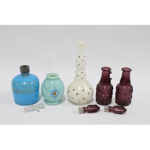 105 - Four glass perfume bottles to include one  inscribed Charles of The Ritz - Moss Rose, together with ... 