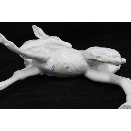 106 - Meissen white-glazed model of a deer, blue crossed swords mark and numbered D747, 20cm