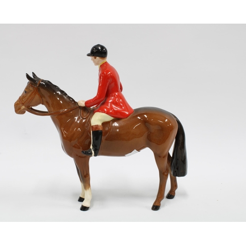 120 - Beswick huntsman on horse with black cap and red jacket, 21cm