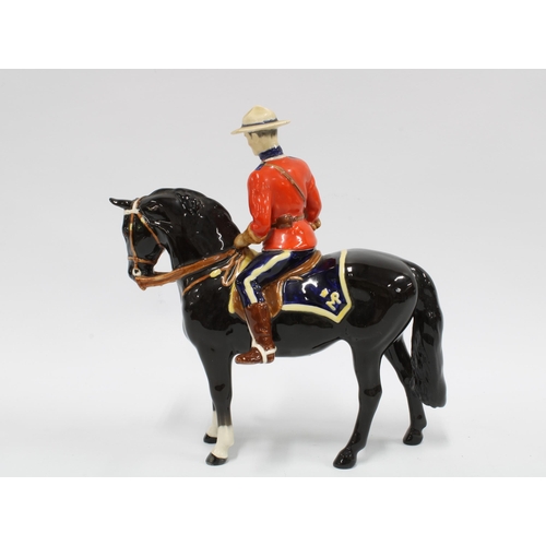 121 - Beswick figure of a Canadian Mountie on horse, a/f with restoration of a neck break, 21cm