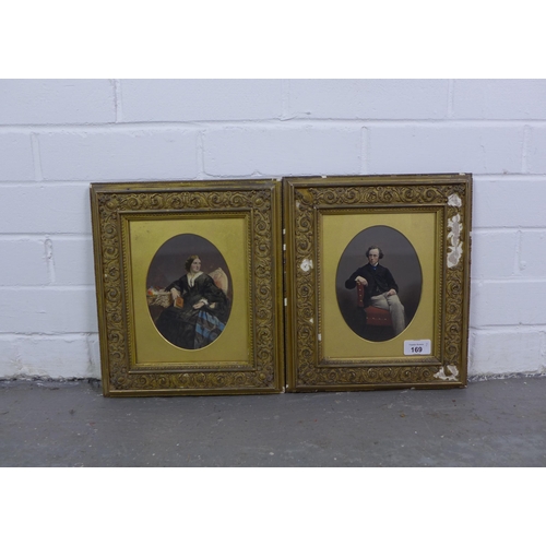 169 - A pair of 19th century male and female painted over prints, each in an oval mount, under glass and w... 