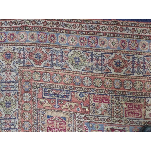 200 - Large Eastern carpet, pink field with allover pattern of square panels within flowerhead borders, ev... 