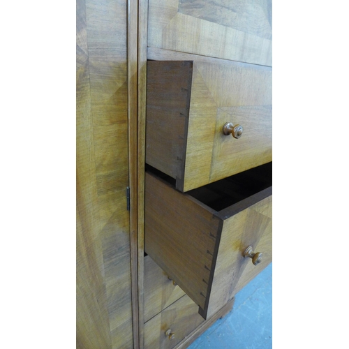 201 - Whytock & Reid walnut wardrobe, flat top with rounded edge over a pair of central robe doors which o... 