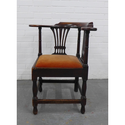 203 - A mahogany corner chair with double pierced splat back, upholstered slip in seat, raised on baluster... 