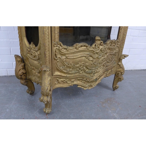 204 - Gilt wood glazed cabinet, Italianate in style, with rococo surmount and mouldings, front door is gla... 