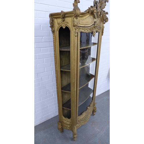 204 - Gilt wood glazed cabinet, Italianate in style, with rococo surmount and mouldings, front door is gla... 